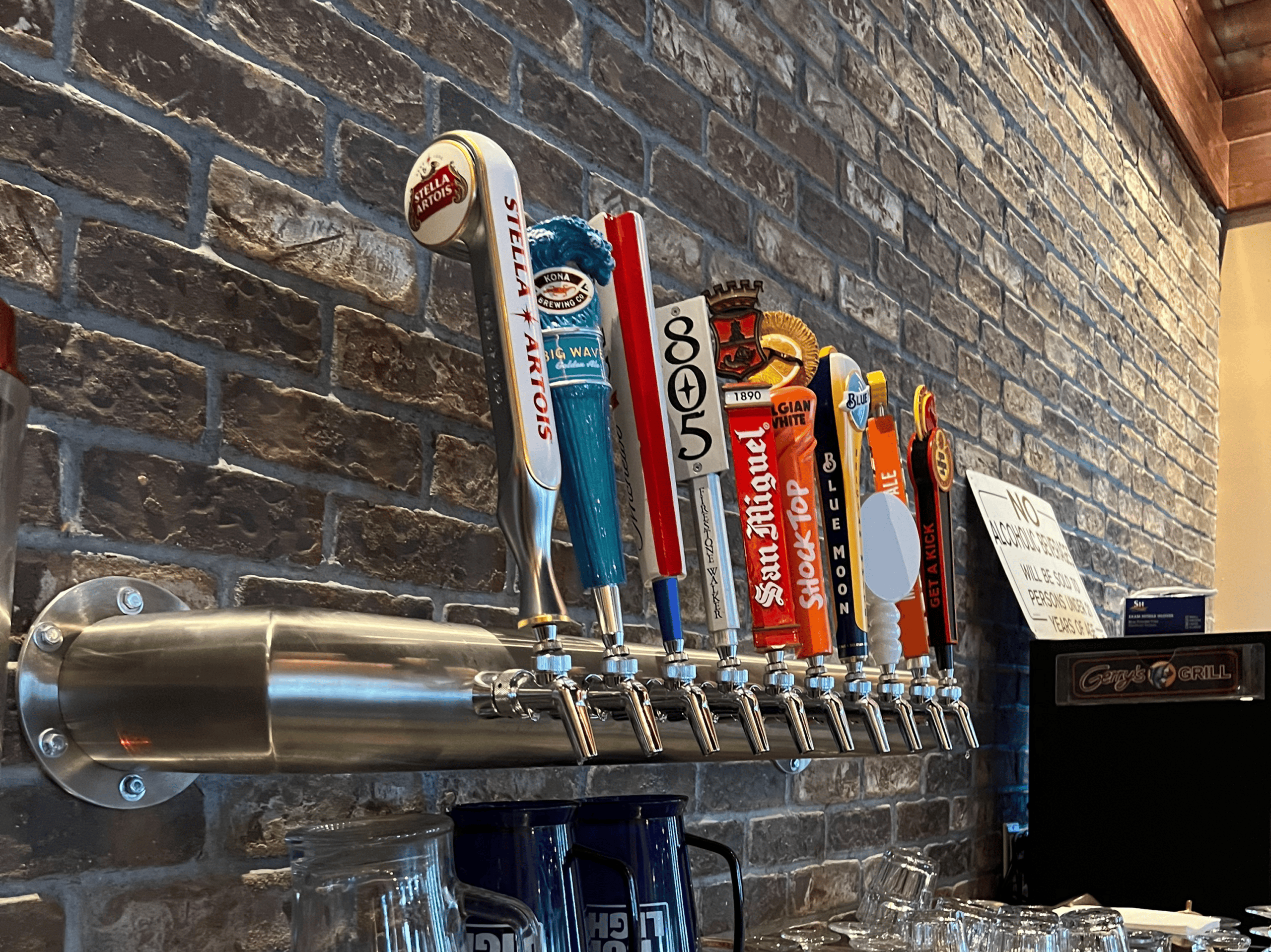 Multiple Draftsman beer taps on a wall at a brewery or bar setting.