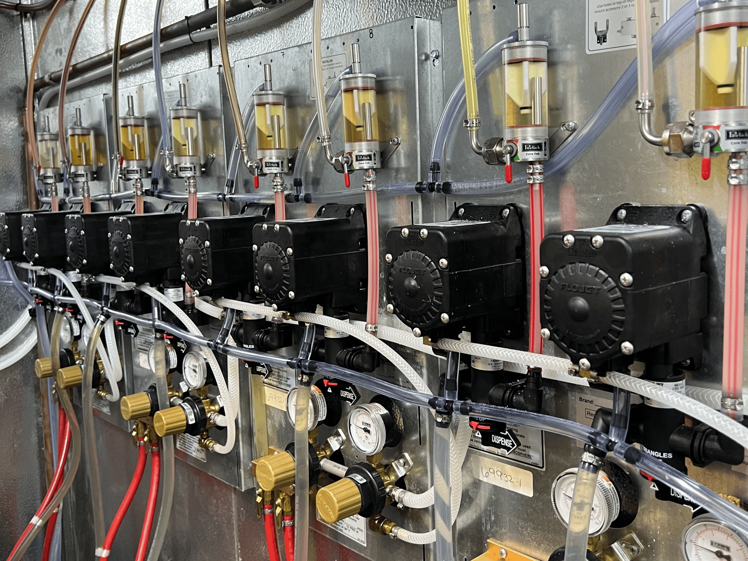 Industrial beer brewing equipment with gauges and pipes at Example Co.